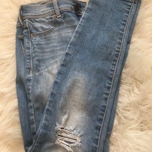 Abercrombie light wash jeans with a tear at knees
